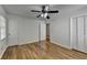 Bright bedroom with hardwood floors, ceiling fan, and ample closet space at 1365 Renee Dr, Decatur, GA 30035