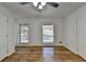 Spacious bedroom with hardwood floors and two large windows at 1365 Renee Dr, Decatur, GA 30035
