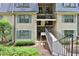 Tan building exterior with gray roof, multiple windows, and walkway at 52 Lamsden Nw Ln, Atlanta, GA 30327