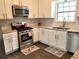 Renovated kitchen with granite countertops and stainless steel appliances at 2961 Hawk Se Ct, Marietta, GA 30067