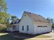 Rear view of house highlighting the garage and additional structure at 8948 Ephesus Church Rd, Villa Rica, GA 30180