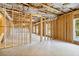 Unfinished basement with exposed framing and large windows at 6108 Hutchins Dr, Buford, GA 30518