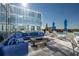 Rooftop patio with a fire pit and comfortable blue seating at 1065 Peachtree Ne St # 3201, Atlanta, GA 30309