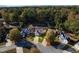 Aerial view of a quiet residential neighborhood with houses and lush green trees at 215 Mackenzie Ct, Canton, GA 30115