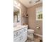 Charming bathroom with white vanity and a window at 215 Mackenzie Ct, Canton, GA 30115