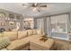 Spacious living room with sectional sofa and access to backyard at 215 Mackenzie Ct, Canton, GA 30115