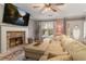 Spacious living room with a stone fireplace and large sectional sofa at 215 Mackenzie Ct, Canton, GA 30115