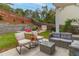 Spacious backyard with patio furniture and fire pit at 215 Mackenzie Ct, Canton, GA 30115