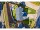 Aerial view showcasing house, landscaping, and driveway at 215 Mackenzie Ct, Canton, GA 30115