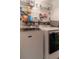 Laundry room with washer, dryer, and ample storage at 215 Mackenzie Ct, Canton, GA 30115