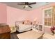 Pink bedroom with a daybed and built-in shelving at 215 Mackenzie Ct, Canton, GA 30115