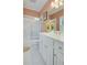 Bright bathroom with a white vanity and tiled flooring at 1144 Bellewood Sq, Dunwoody, GA 30338