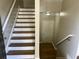 Wood and white staircase leading to the upper level at 3923 High Dove Sw Way # 16, Smyrna, GA 30082