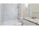 Updated bathroom with marble tile shower and granite vanity at 2519 Godfrey Nw Dr, Atlanta, GA 30318