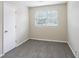 Simple bedroom with grey carpet and neutral walls at 2519 Godfrey Nw Dr, Atlanta, GA 30318