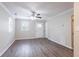 Spacious living room featuring hardwood floors and a ceiling fan at 2519 Godfrey Nw Dr, Atlanta, GA 30318