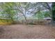 Spacious backyard with mature trees and privacy fence at 2519 Godfrey Nw Dr, Atlanta, GA 30318