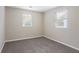 Spacious bedroom with neutral colored carpet and walls at 2519 Godfrey Nw Dr, Atlanta, GA 30318