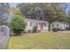 Charming white brick ranch home with a red door at 2519 Godfrey Nw Dr, Atlanta, GA 30318