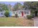 Charming white brick ranch home with a red door at 2519 Godfrey Nw Dr, Atlanta, GA 30318