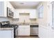 Modern kitchen with granite countertops and stainless steel appliances at 2519 Godfrey Nw Dr, Atlanta, GA 30318
