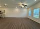 Spacious living room with hardwood floors and ceiling fan at 2102 Stillhaven Pl, Douglasville, GA 30135