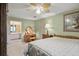 Spacious main bedroom with ensuite access and a large bed at 5892 Smoke Rise Ct, Stone Mountain, GA 30087