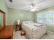 Serene bedroom with a metal bed frame and large window at 5892 Smoke Rise Ct, Stone Mountain, GA 30087