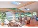 Bright screened porch with wicker furniture and a view of the garden at 5892 Smoke Rise Ct, Stone Mountain, GA 30087