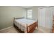 Cozy bedroom with a wooden bed frame and ample closet space at 5892 Smoke Rise Ct, Stone Mountain, GA 30087