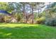Landscaped backyard with lush greenery at 5892 Smoke Rise Ct, Stone Mountain, GA 30087