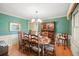 Charming dining room with a large table and built-in hutch at 5892 Smoke Rise Ct, Stone Mountain, GA 30087