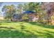 Two-story house with a large backyard and deck at 5892 Smoke Rise Ct, Stone Mountain, GA 30087