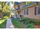 Charming two-story house with a walkway and manicured landscaping at 5892 Smoke Rise Ct, Stone Mountain, GA 30087