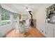 Cozy breakfast nook with a wood-burning stove and hardwood floors at 5892 Smoke Rise Ct, Stone Mountain, GA 30087