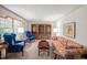 Bright living room features a built-in shelving unit and comfortable seating at 5892 Smoke Rise Ct, Stone Mountain, GA 30087