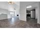 Open concept dining room with tile floors, leading to the living room and kitchen at 3238 Windgate Ne Dr, Buford, GA 30519