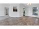 Dining area with tile floors and view into kitchen at 3238 Windgate Ne Dr, Buford, GA 30519