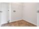 Laundry room with tile floor and wire shelving at 3238 Windgate Ne Dr, Buford, GA 30519