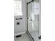 Clean shower with marble walls and glass sliding doors at 775 Humphries Sw St, Atlanta, GA 30310