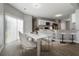 Modern dining room with marble table and chairs, adjacent to the kitchen at 4811 West Gate Blvd, Atlanta, GA 30349