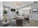 Living room with fireplace, hardwood floors, and ample natural light at 4811 West Gate Blvd, Atlanta, GA 30349