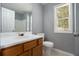 Clean bathroom with wood cabinets and a white sink at 79 Greystone Way, Hiram, GA 30141