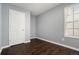 Bedroom with hardwood floors, closet, and window at 79 Greystone Way, Hiram, GA 30141