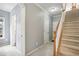 Elegant stairwell with neutral carpeting and wood railing at 1122 Providence Pl, Decatur, GA 30033