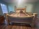 King-size bed with decorative headboard in a spacious main bedroom at 2594 Boulder Springs Pt, Ellenwood, GA 30294