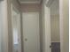 Simple hallway with neutral walls and doors to other rooms at 8060 Northcrest Dr, Jonesboro, GA 30238
