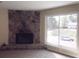 Stone fireplace with large window view at 8060 Northcrest Dr, Jonesboro, GA 30238