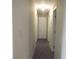 Hallway with carpet and neutral-colored walls at 8060 Northcrest Dr, Jonesboro, GA 30238