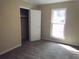 Spacious bedroom with carpeted floor and a large closet at 8060 Northcrest Dr, Jonesboro, GA 30238